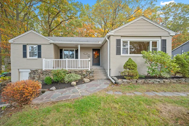 front view of a house with a yard