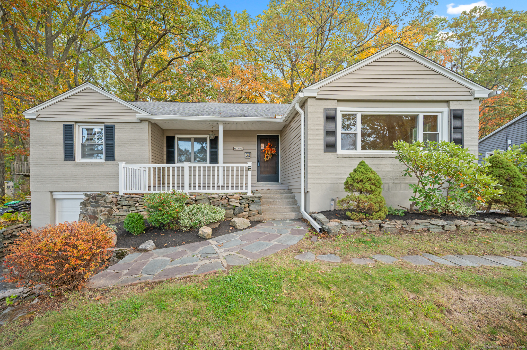 front view of a house with a yard