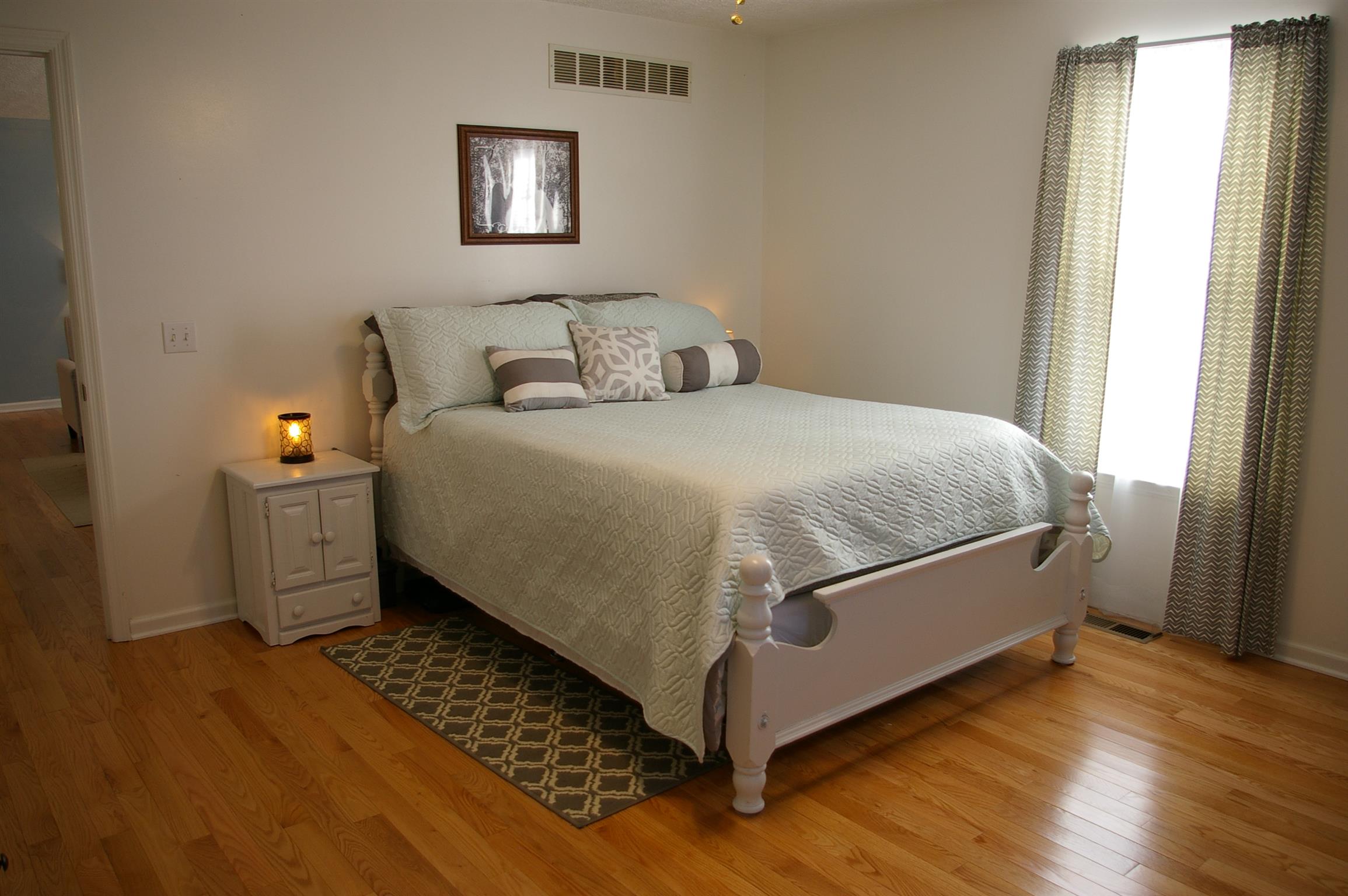 44 Old Pocahontas Road Manchester, TN 37355 - Photo 11 of 20 a bed sitting in a bedroom next to a window