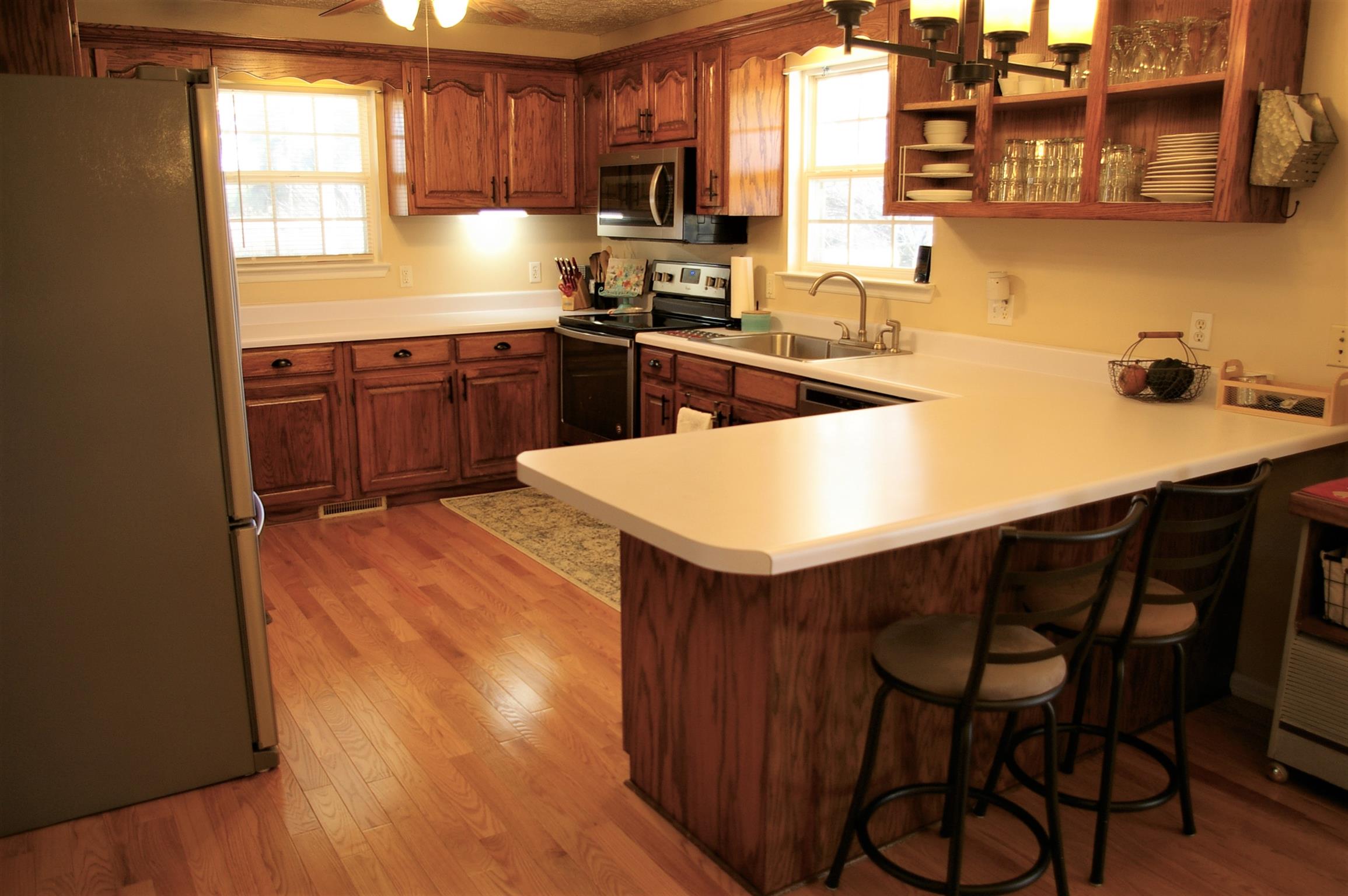 44 Old Pocahontas Road Manchester, TN 37355 - Photo 5 of 20 a kitchen with stainless steel appliances granite countertop a sink table and chairs