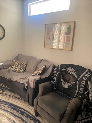 a couple of blue chairs sitting next to a window