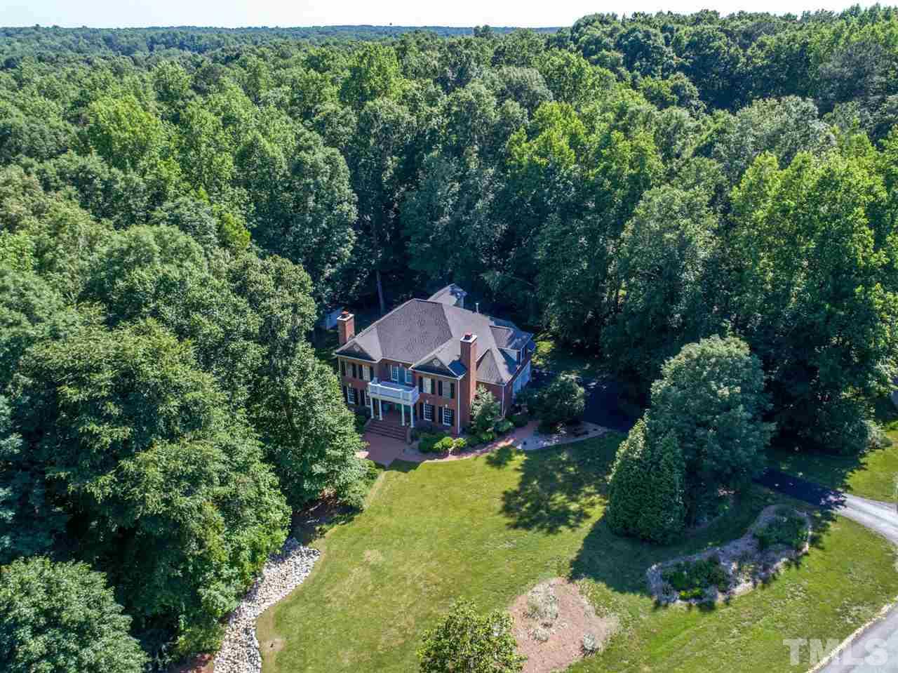 1701 Crown Glenn Place Raleigh, NC 27613 - Photo 2 of 25 an aerial view of a house with yard swimming pool and outdoor seating