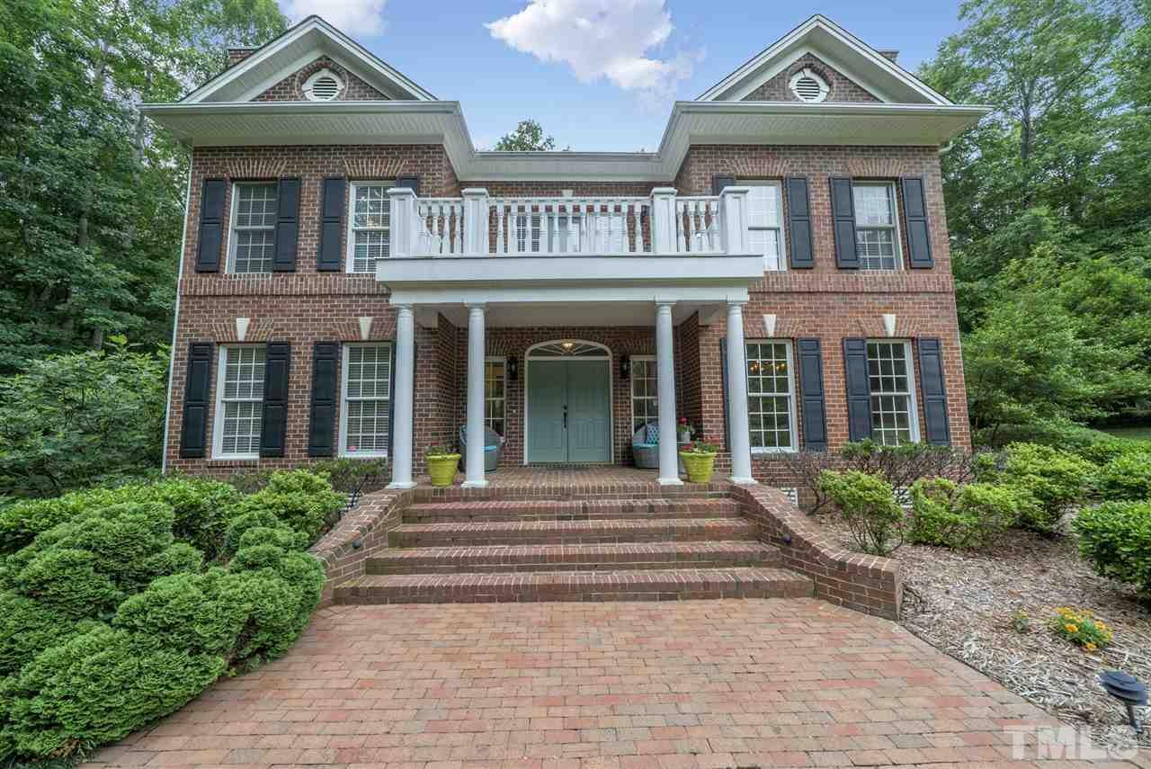 1701 Crown Glenn Place Raleigh, NC 27613 - Photo 3 of 25 a front view of a house with garden and entryway