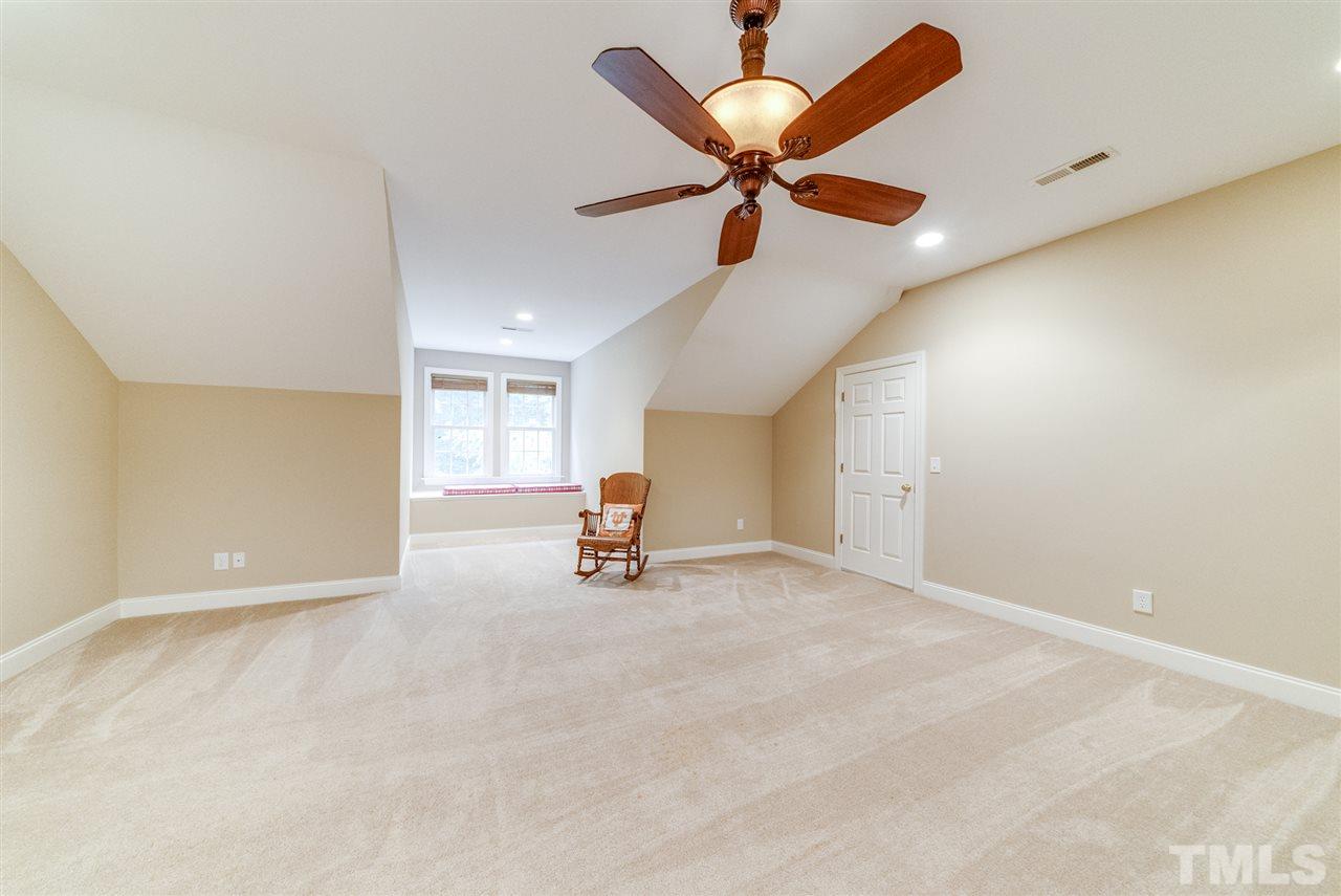 1701 Crown Glenn Place Raleigh, NC 27613 - Photo 25 of 25 an empty room with windows and ceiling fan