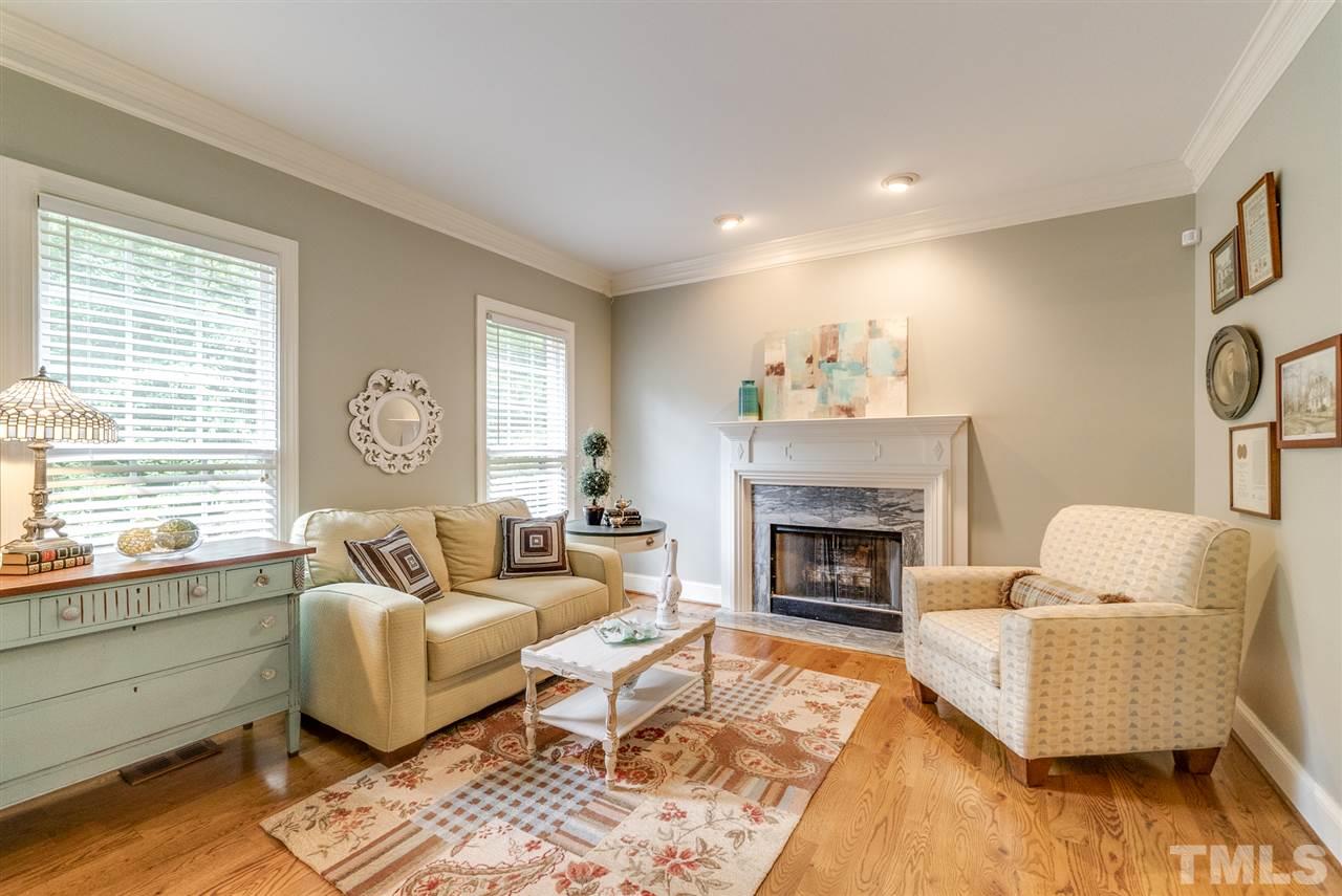 1701 Crown Glenn Place Raleigh, NC 27613 - Photo 8 of 25 a living room with furniture and a fireplace
