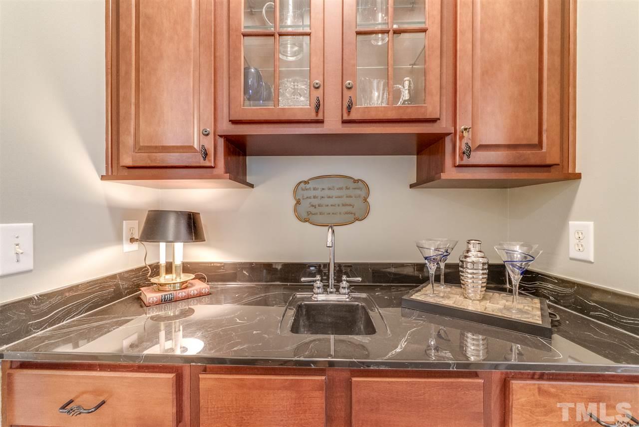 1701 Crown Glenn Place Raleigh, NC 27613 - Photo 9 of 25 a kitchen with a sink and a window