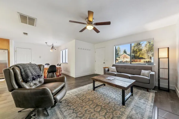 a living room with furniture and a rug