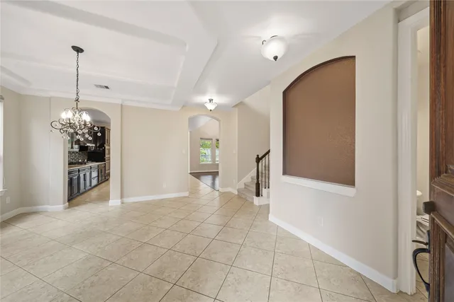 a view of a hallway with a chandelier