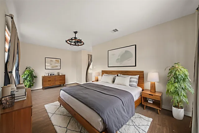 a bedroom with a bed and a couch