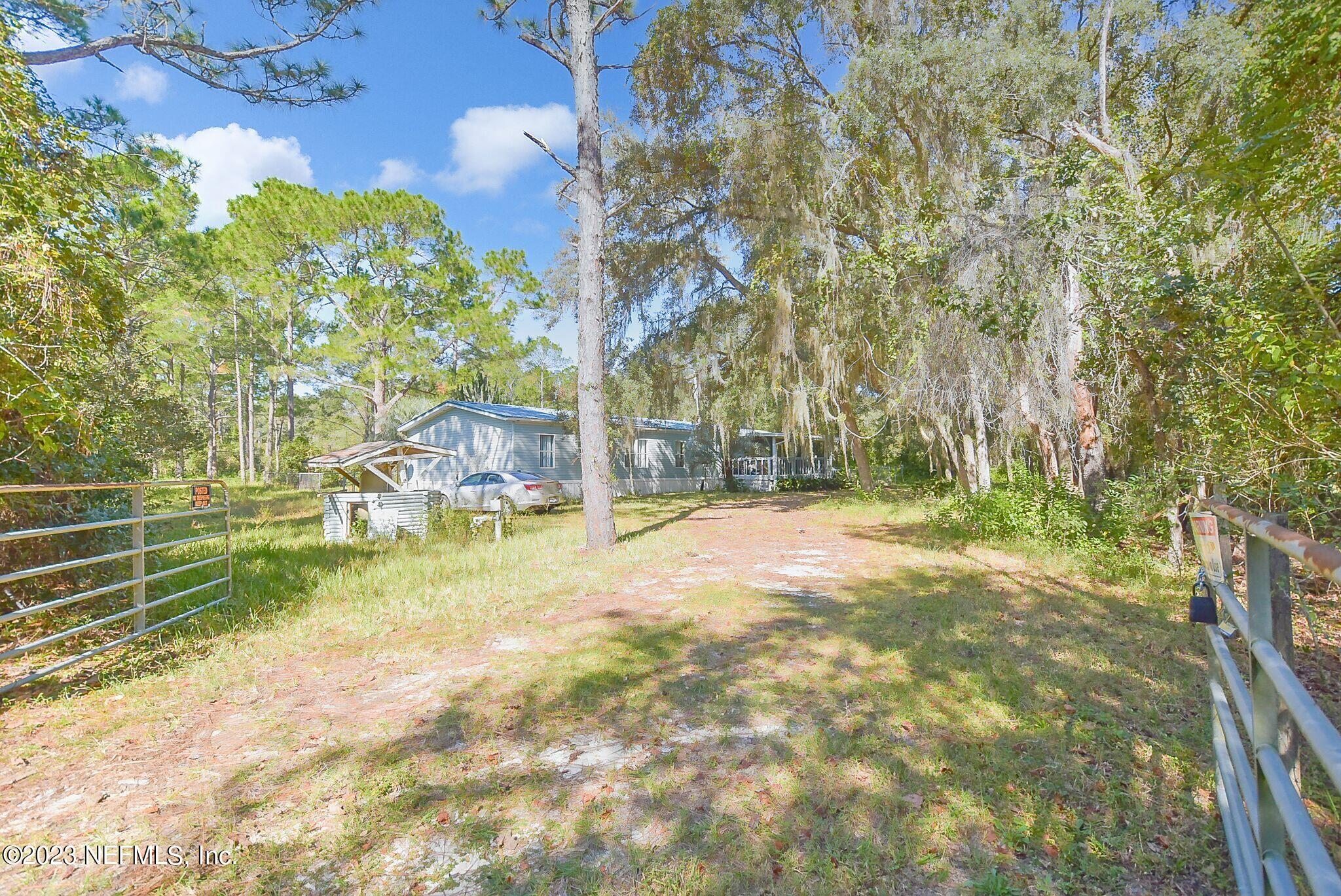 136 Lawrence Lane Georgetown, FL 32139 - Photo 2 of 33 a view of yard with trees