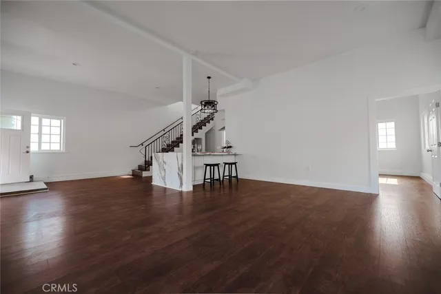 a bathroom with a sink toilet and window