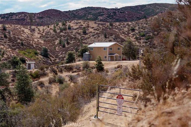 a bathroom with a sink a toilet and a window