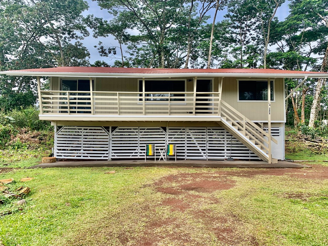14-3404 Hawaii Road Pahoa, HI 96778 - Photo 1 of 22 a side view of a house with a yard