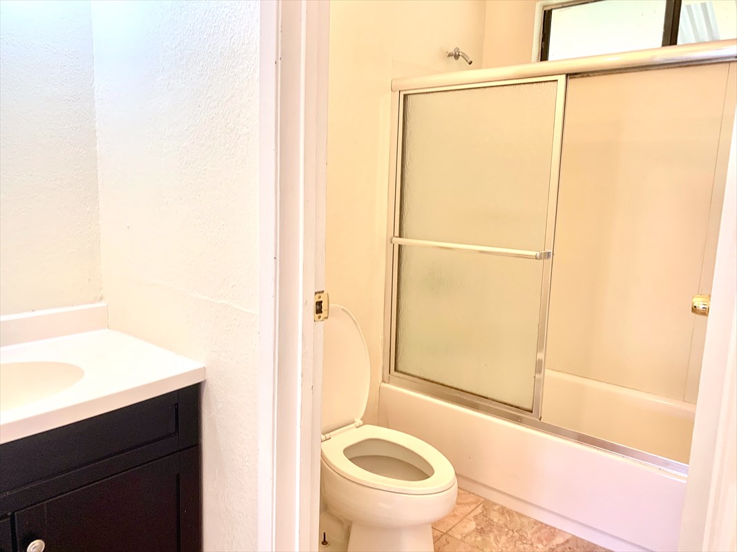 14-3404 Hawaii Road Pahoa, HI 96778 - Photo 12 of 22 a bathroom with a granite countertop shower and a toilet