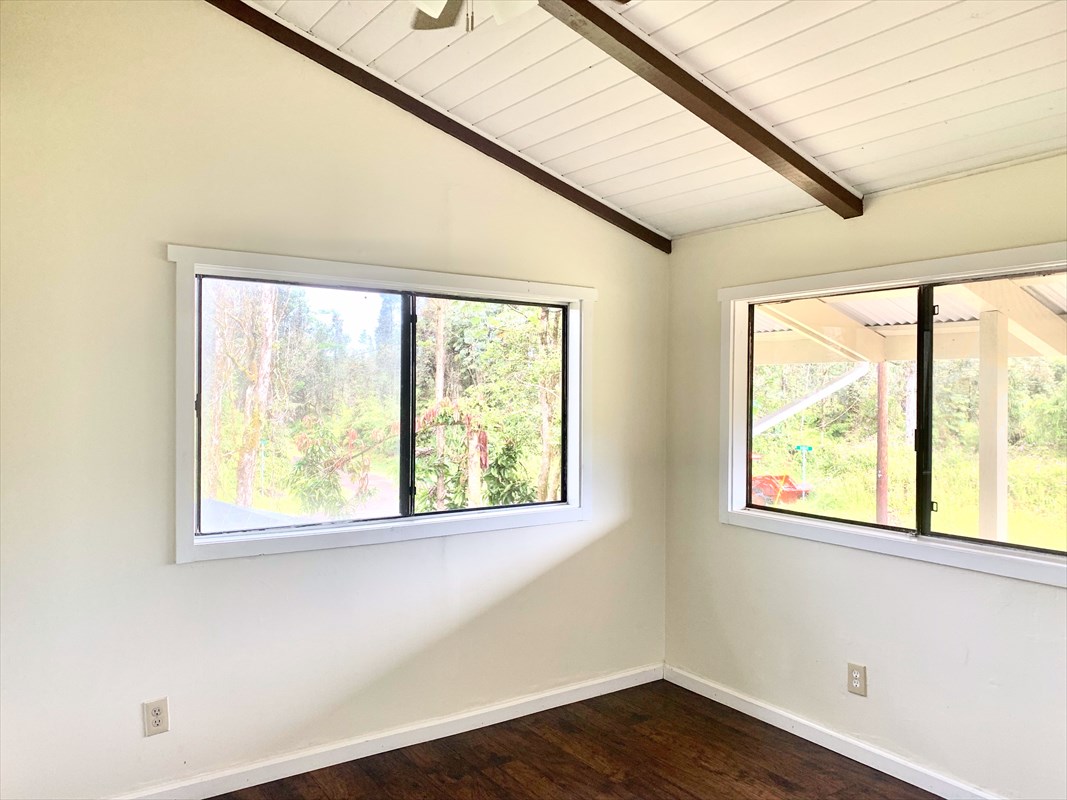 14-3404 Hawaii Road Pahoa, HI 96778 - Photo 15 of 22 a view of an empty room with wooden floor and a window