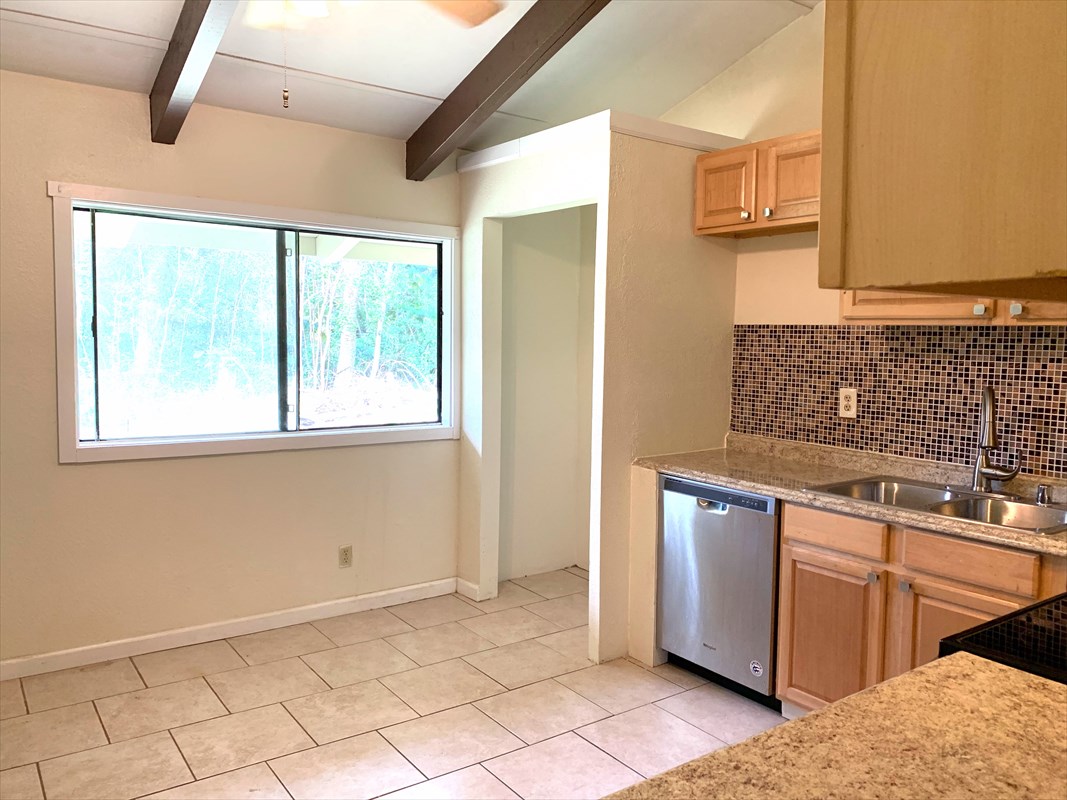 14-3404 Hawaii Road Pahoa, HI 96778 - Photo 3 of 22 a kitchen with stainless steel appliances granite countertop a sink and a cabinets