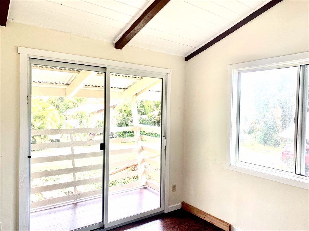14-3404 Hawaii Road Pahoa, HI 96778 - Photo 7 of 22 a view of a big room with wooden floor and doors