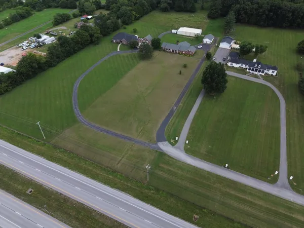 an aerial view of a house with a garden
