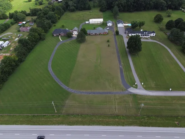 an aerial view of a house with a garden
