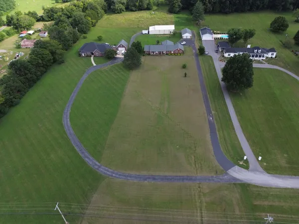 an aerial view of a house having yard