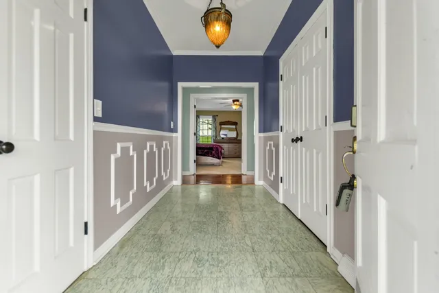 a view of a hallway view with wooden floor and staircase