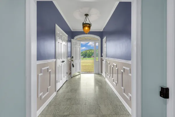 a view of a hallway view with staircase