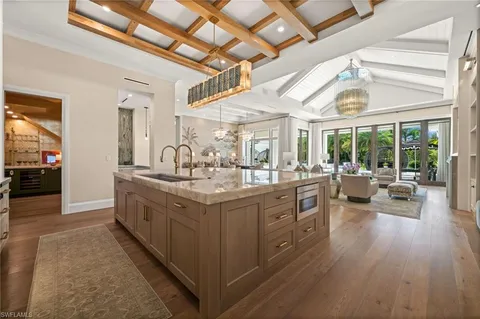 a kitchen with stainless steel appliances a sink and cabinets