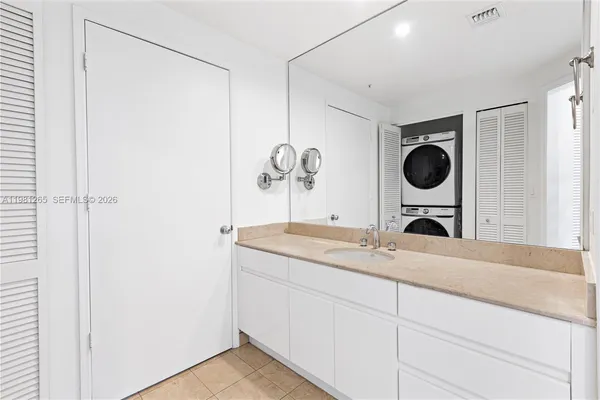 a utility room with a sink dryer and washer