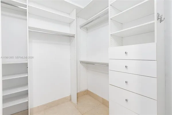 a view of an empty walk in closet