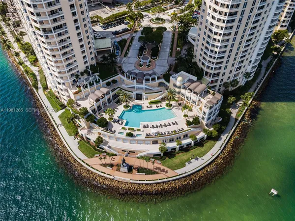 a swimming pool with trees in the background