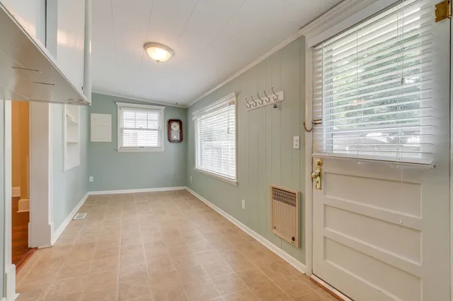 a view of an empty room with a window