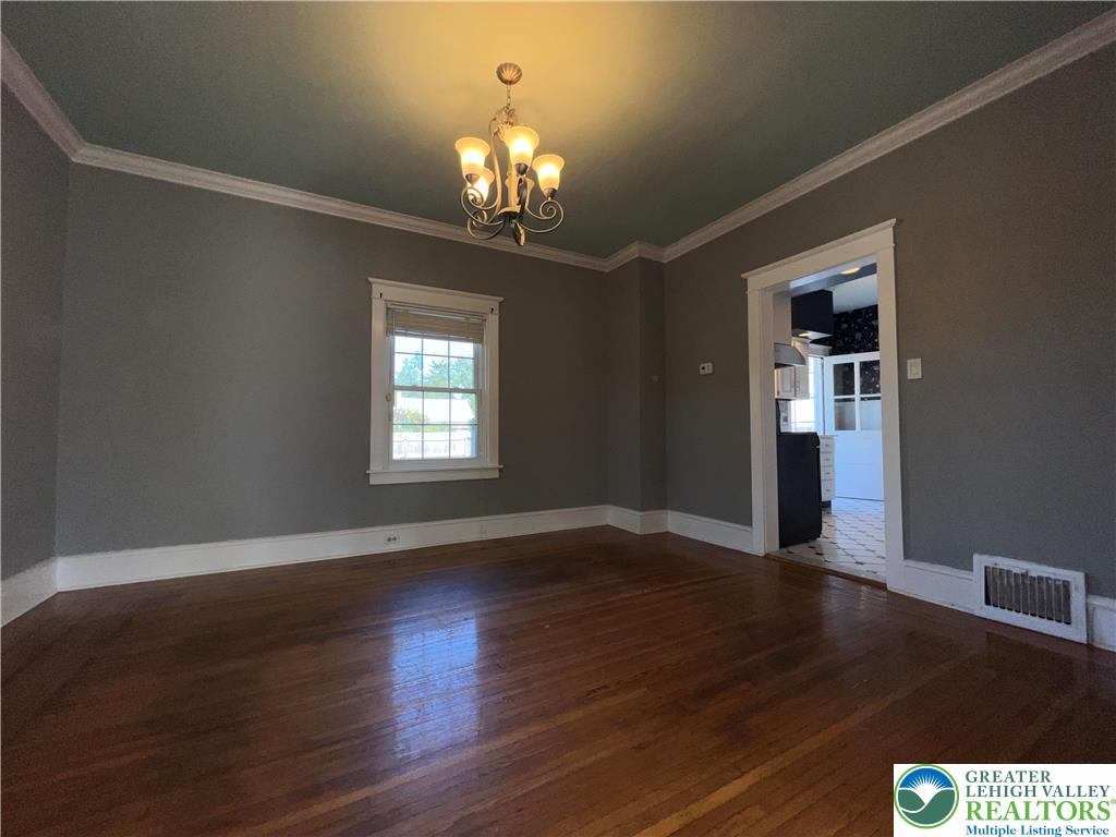 135 West Wabash Street Allentown, PA 18103 - Photo 20 of 69 a view of an empty room with wooden floor and a window