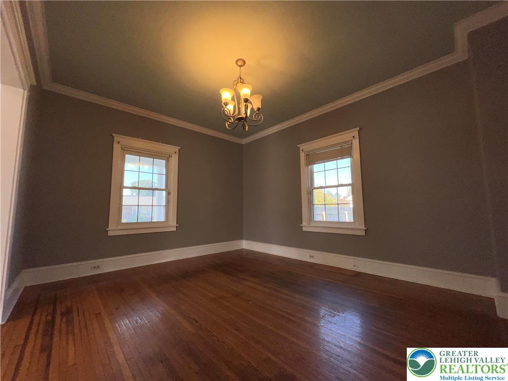 135 West Wabash Street Allentown, PA 18103 - Photo 22 of 69 a view of an empty room with wooden floor and a window