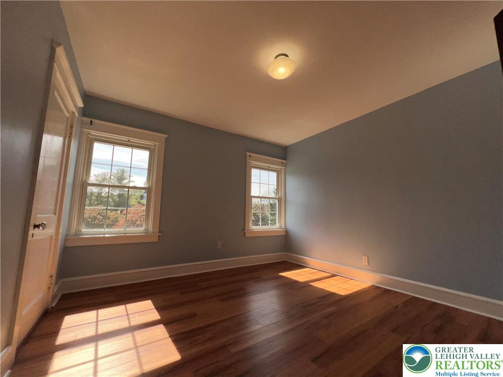 135 West Wabash Street Allentown, PA 18103 - Photo 26 of 69 an empty room with wooden floor and windows