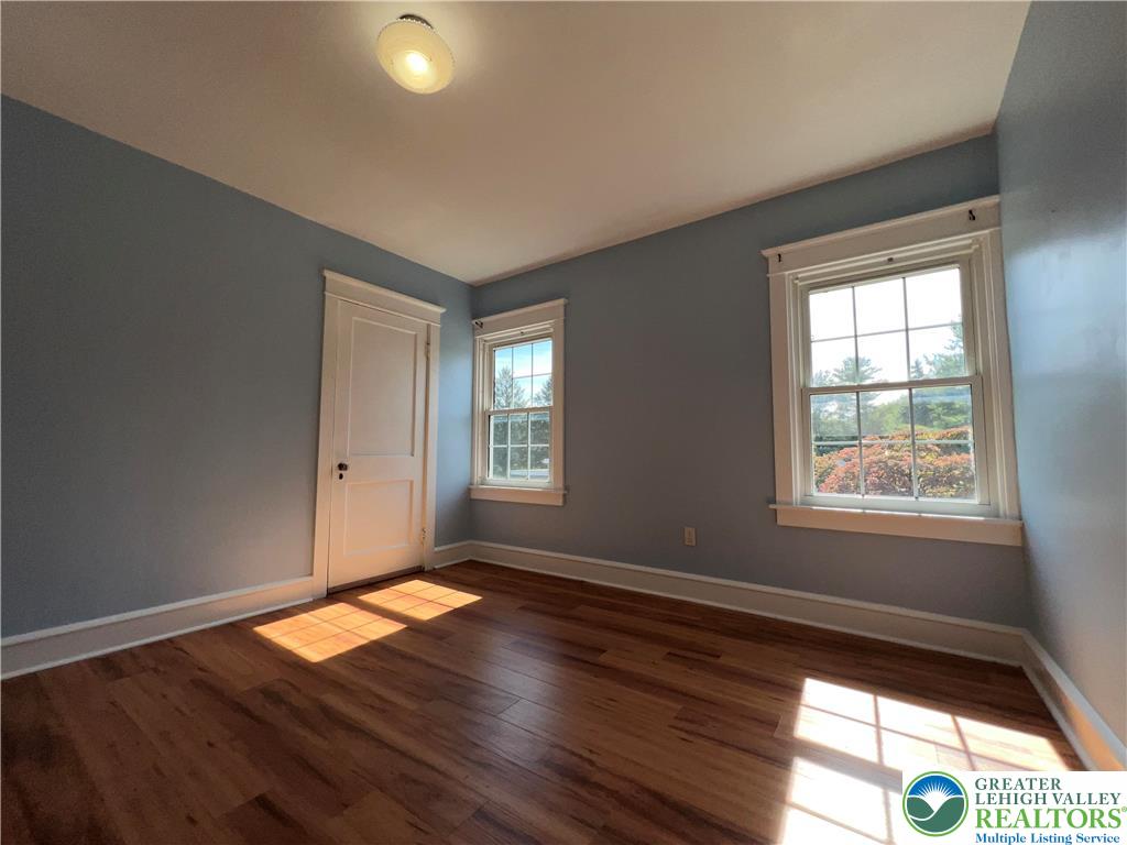 135 West Wabash Street Allentown, PA 18103 - Photo 27 of 69 a view of an empty room with wooden floor and a window