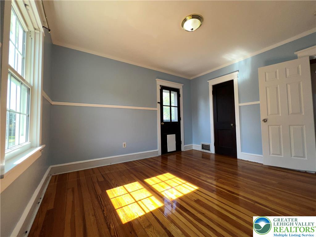 135 West Wabash Street Allentown, PA 18103 - Photo 29 of 69 an empty room with wooden floor and windows