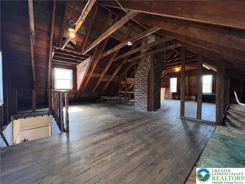 135 West Wabash Street Allentown, PA 18103 - Photo 39 of 69 a view of an empty room with wooden floor and stairs