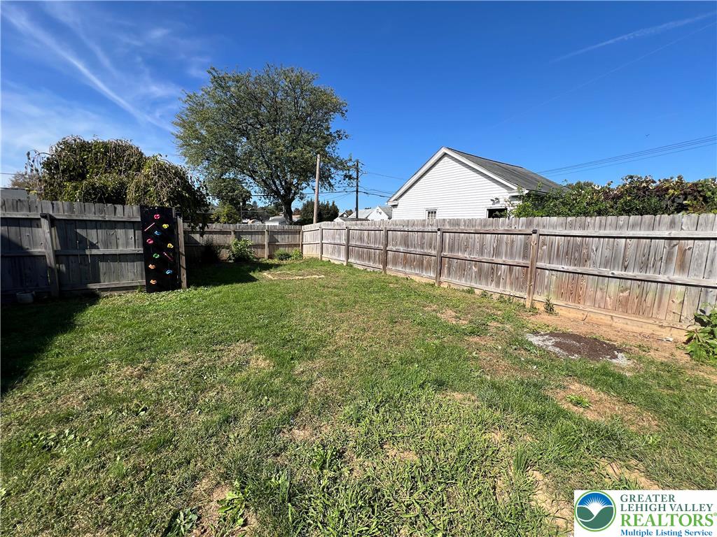 135 West Wabash Street Allentown, PA 18103 - Photo 56 of 69 a view of a backyard with a garden and fire pit