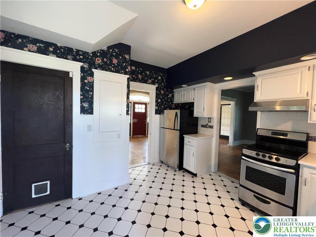 135 West Wabash Street Allentown, PA 18103 - Photo 6 of 69 a kitchen with stainless steel appliances a refrigerator and a stove top oven