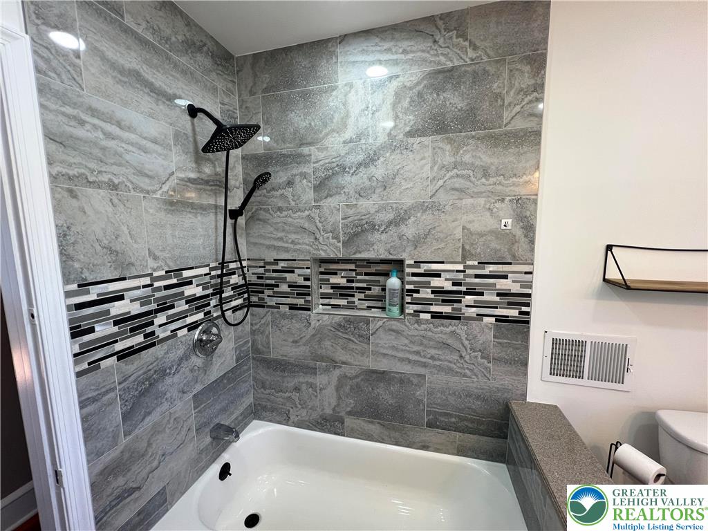 135 West Wabash Street Allentown, PA 18103 - Photo 9 of 69 a bathroom with a bathtub