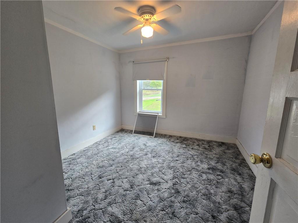 175 Walcott Street Clymer, PA 15728 - Photo 19 of 24 a view of empty room with window and ceiling fan