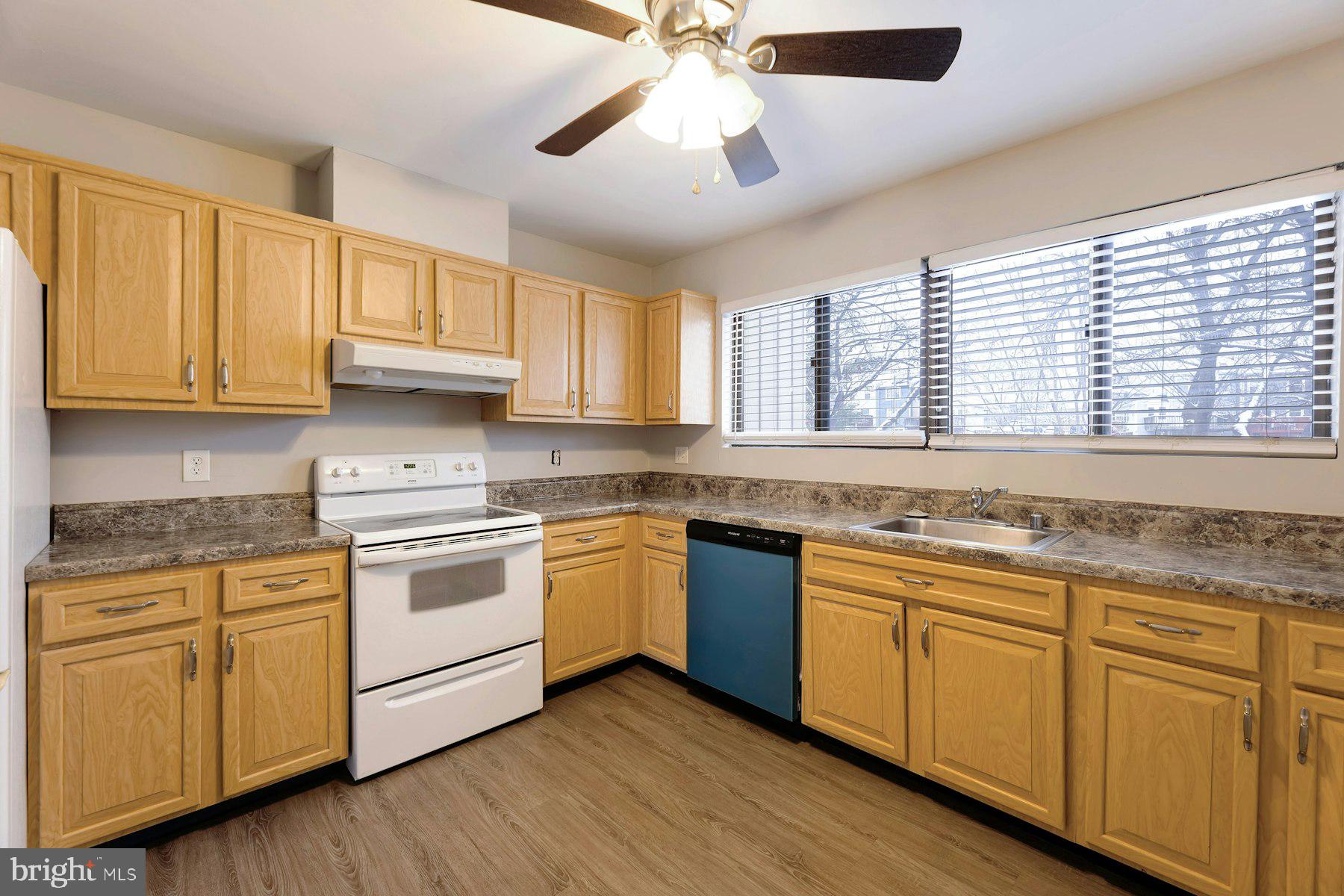 2105 Old Landing Way Woodbridge, VA 22191 - Photo 13 of 30 a kitchen with granite countertop white cabinets and white stainless steel appliances