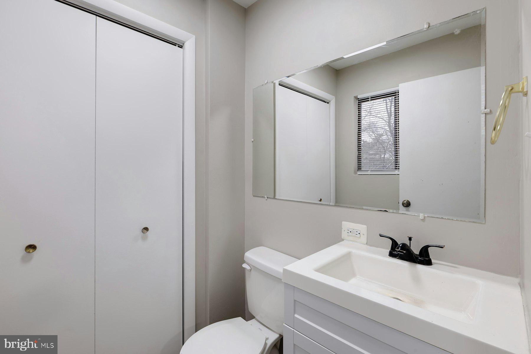 2105 Old Landing Way Woodbridge, VA 22191 - Photo 20 of 30 a bathroom with a sink a toilet and a mirror