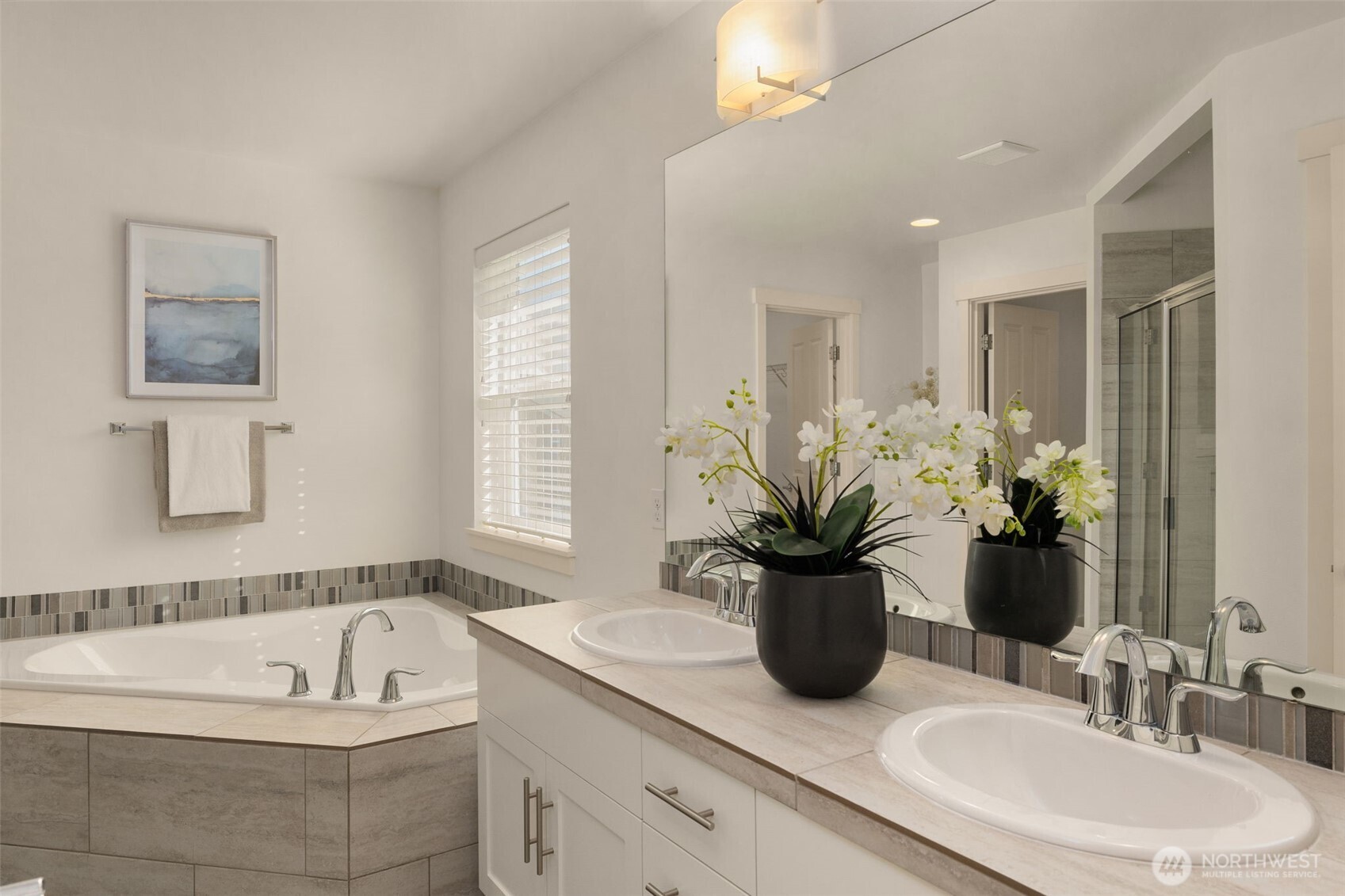 24 174th Place Southwest Bothell, WA 98012 - Photo 14 of 33 a bathroom with a tub a sink and a mirror