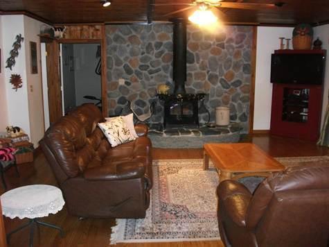 257 East Pond Road Jefferson, ME 04348 - Photo 12 of 18 Living Room. Living room stonework...