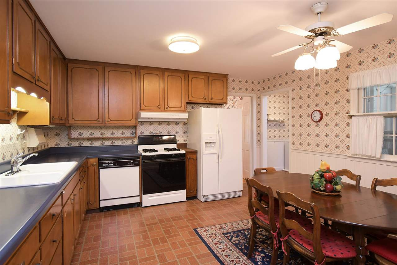 505 South Hollybrook Road Wendell, NC 27591 - Photo 9 of 24 Spacious kitchen with ample cabinets and counter space overlooking the backyard. Kitchen