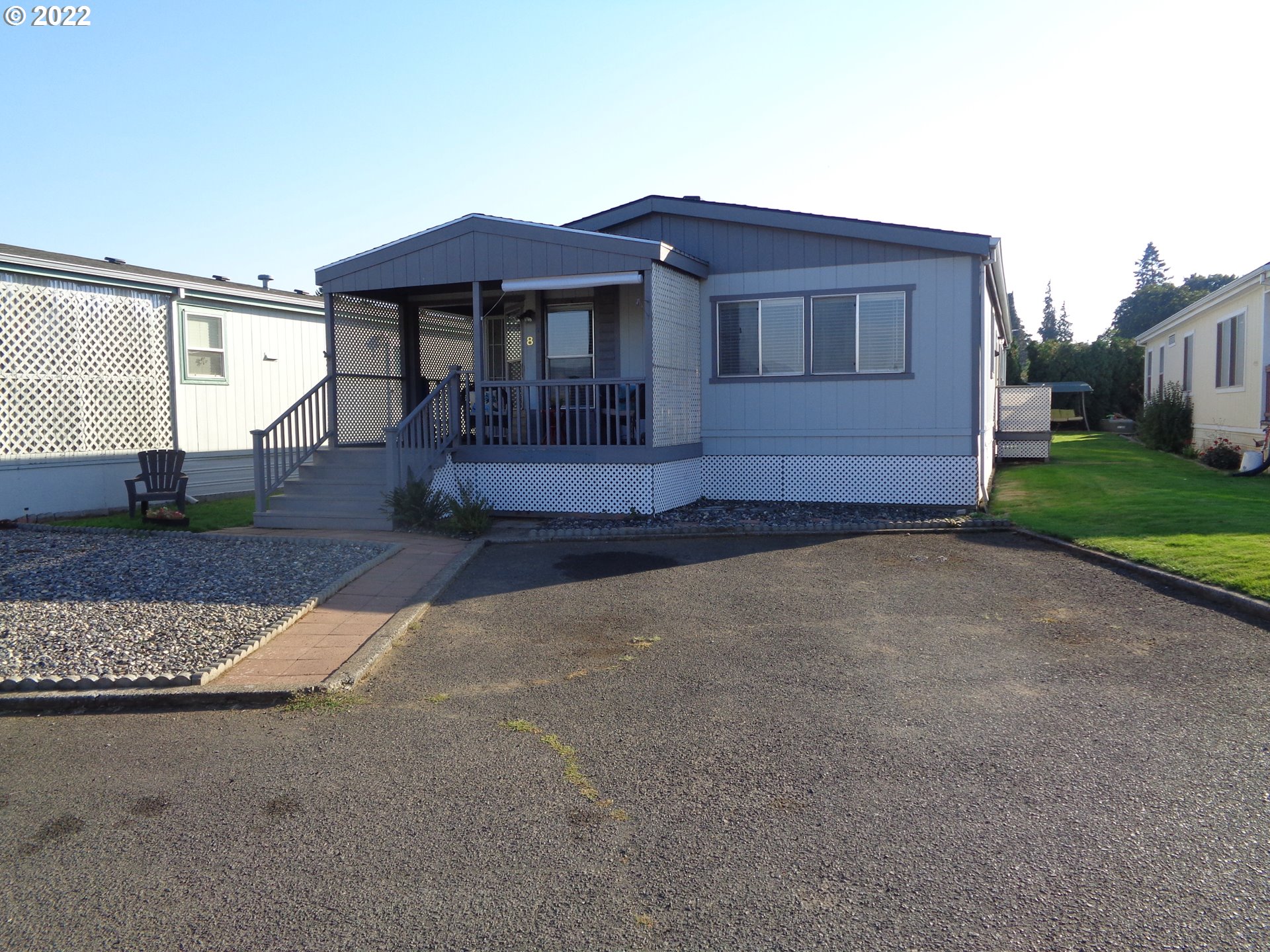 1267 Tucker Road, Unit 8 Hood River, OR 97031 - Photo 1 of 21 a front view of a house with garden