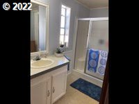1267 Tucker Road, Unit 8 Hood River, OR 97031 - Photo 20 of 21 a bathroom with a sink and a mirror