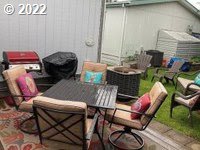 1267 Tucker Road, Unit 8 Hood River, OR 97031 - Photo 5 of 21 a balcony with furniture and a potted plant