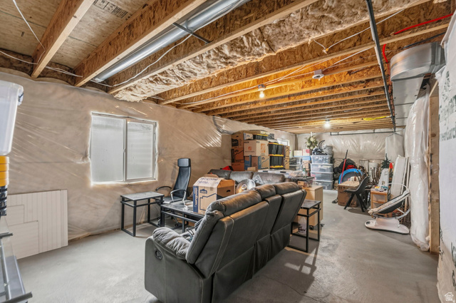 7685 Timber Country Road Eagle Mountain, UT 84005 - Photo 26 of 39 Unfinished basement featuring exposed wood joists and insulation